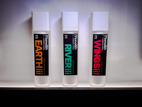 A showcase with Monolith Series Earth (Silicone Lubricant), River (Water Lubricant), Wings (Hybrid Lubricant) together with decoration of Carbon Copy souvenir