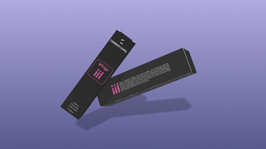Two black boxes of Wings Hybrid Lubricant with pink text on a purple background